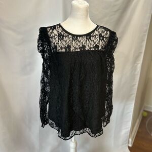 Brand new LOFT black lace blouse with a black lining and a button closure in L.